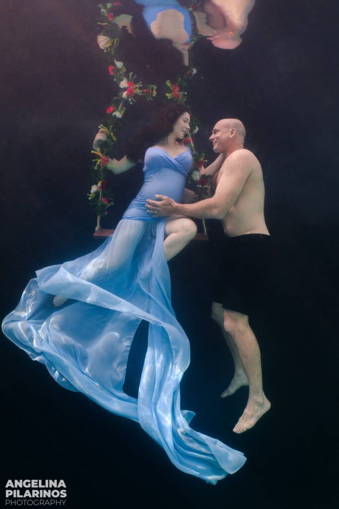 couples underwater maternity shoot