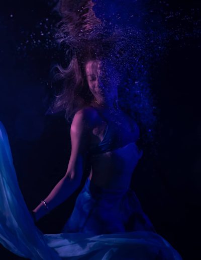 underwater portrait of a woman in a pool