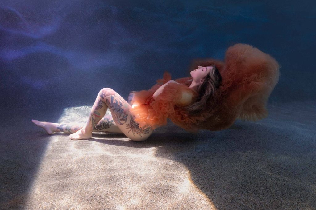 Underwater maternity session in heated Cairns swimming pool