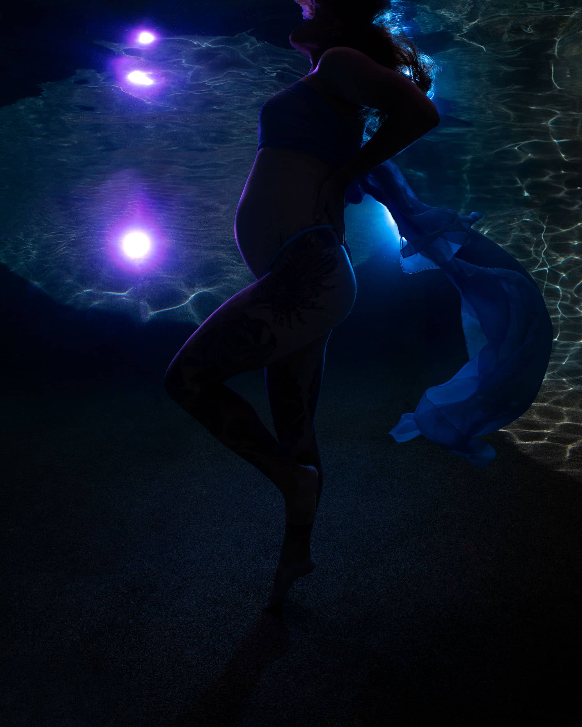 Underwater maternity session in heated Cairns swimming pool
