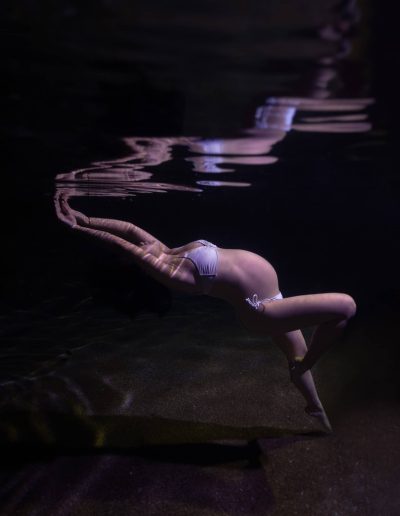 Mother-to-be in serene underwater maternity portrait in Port Douglas