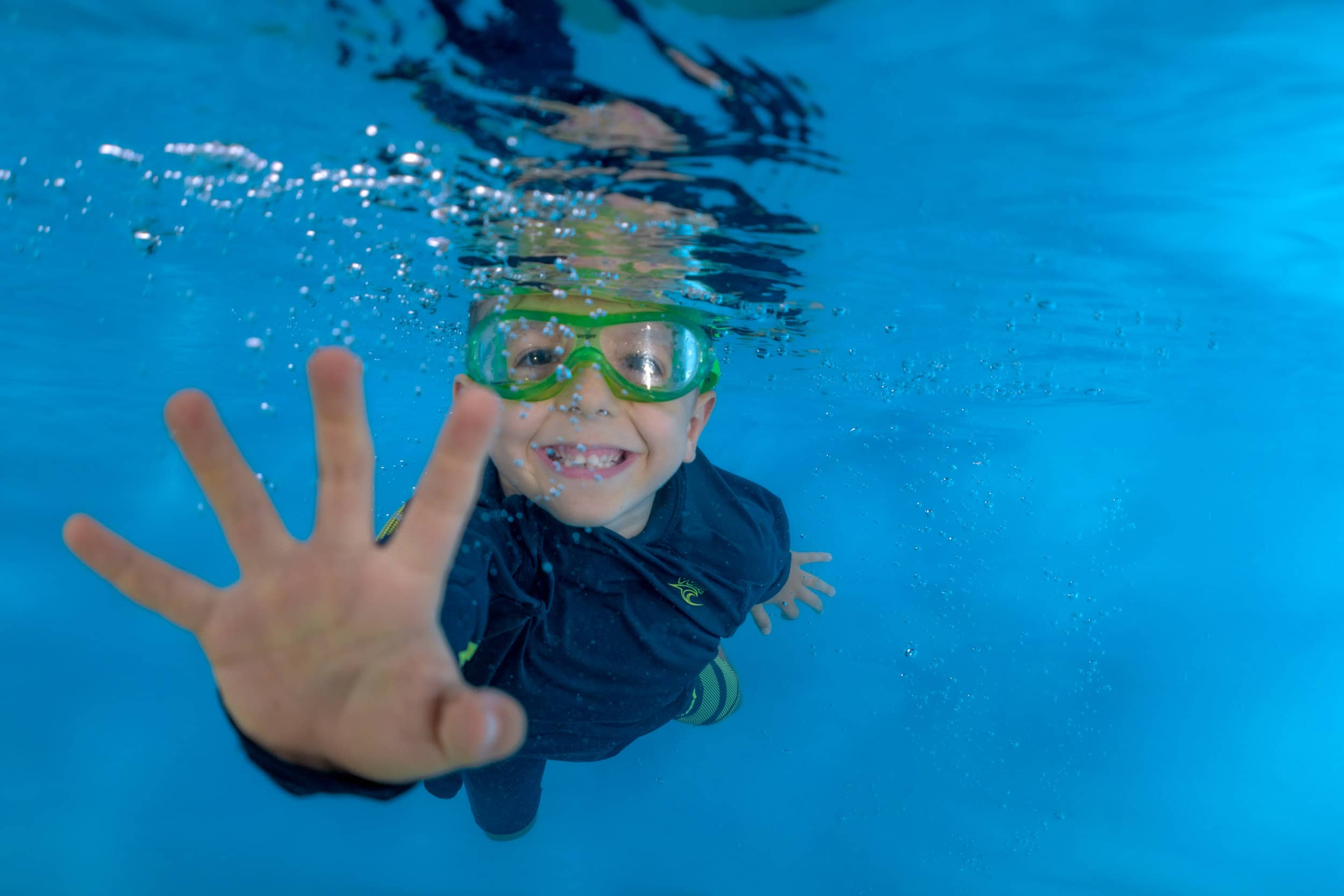 Underwater photo of a child from a swim school photo day.