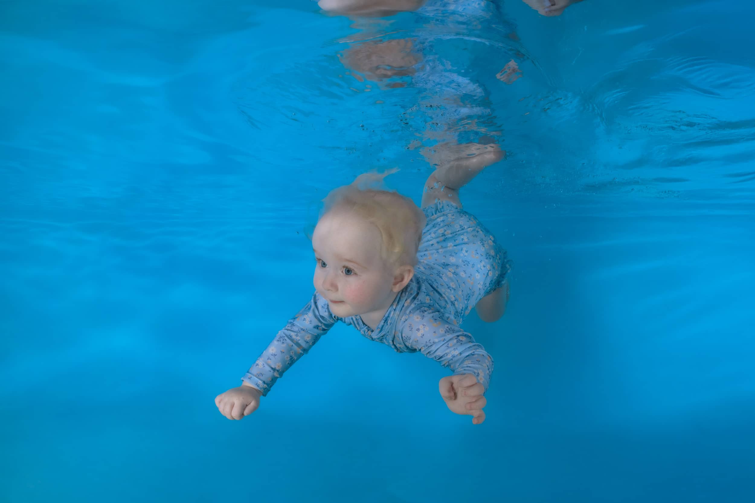 Underwater photo of a child from a swim school photo day.
