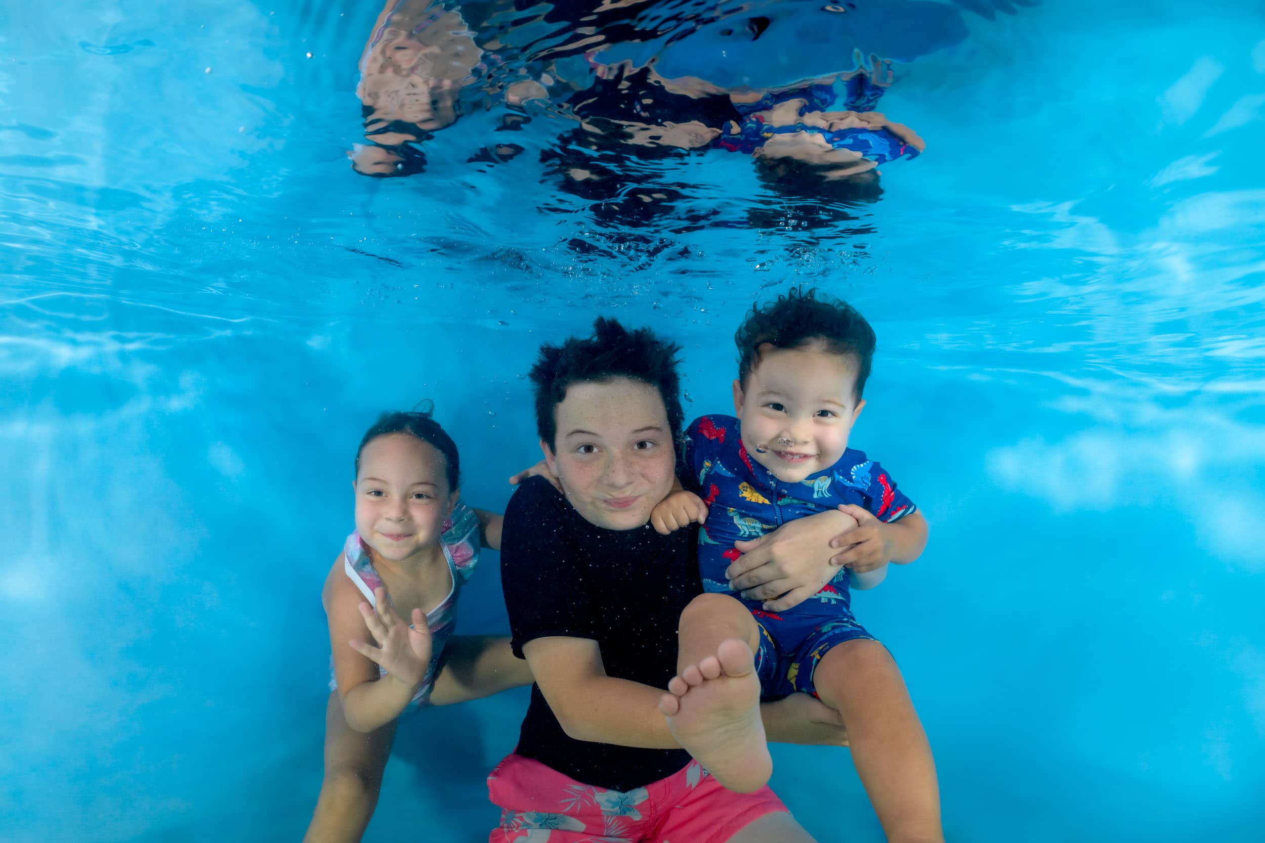 Underwater photo of a child from a swim school photo day.