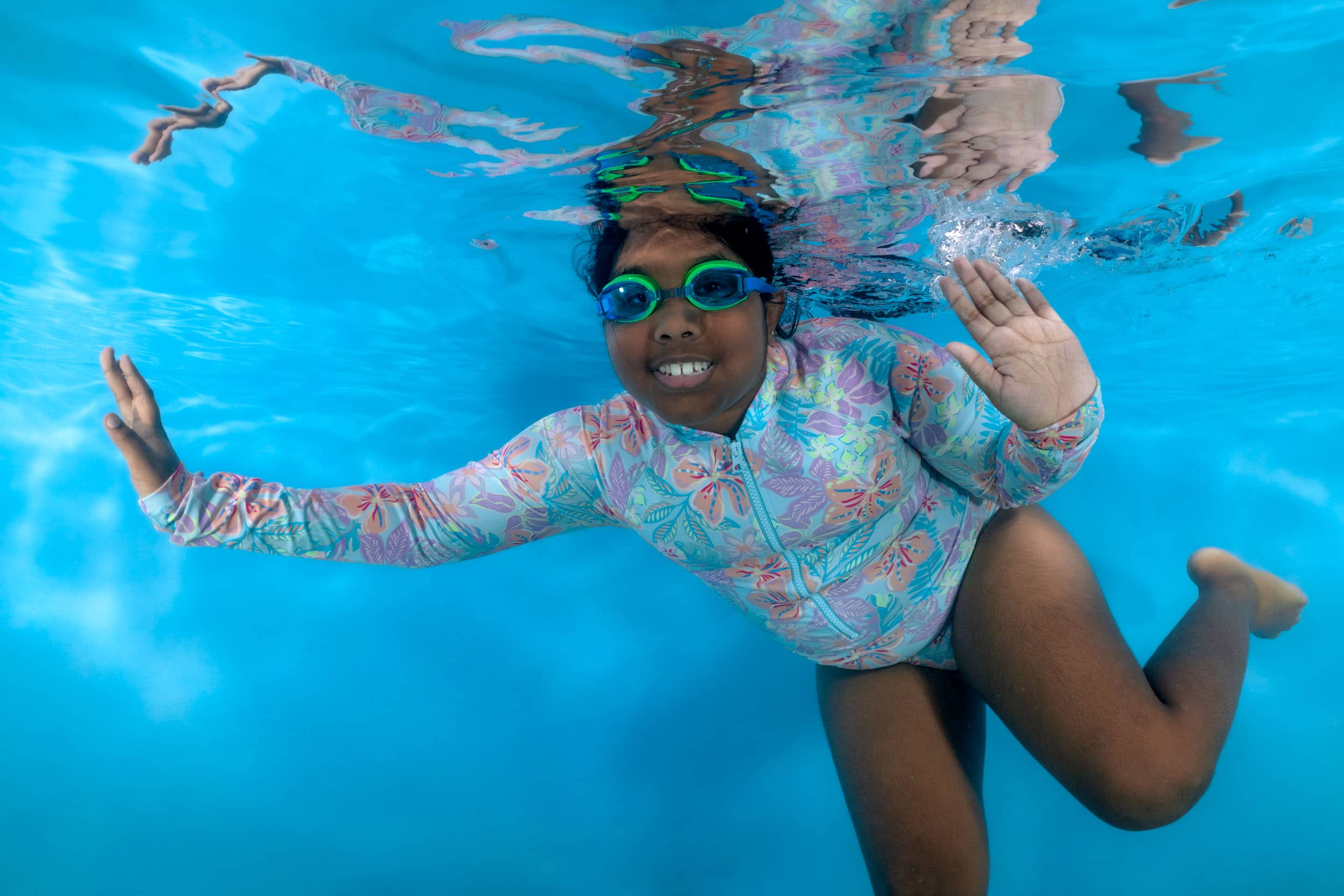 Underwater photo of a child from a swim school photo day.