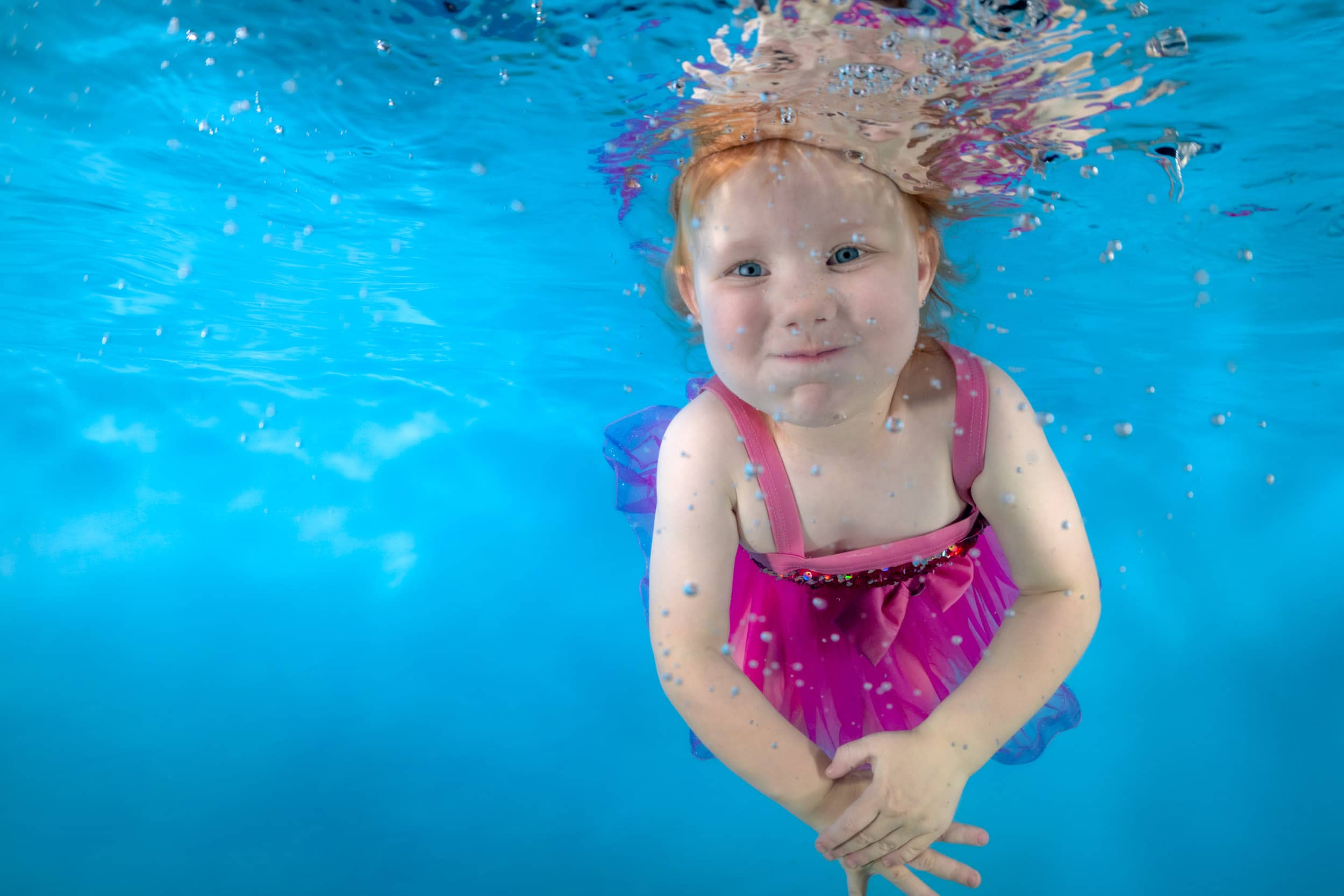 Underwater photo of a child from a swim school photo day.