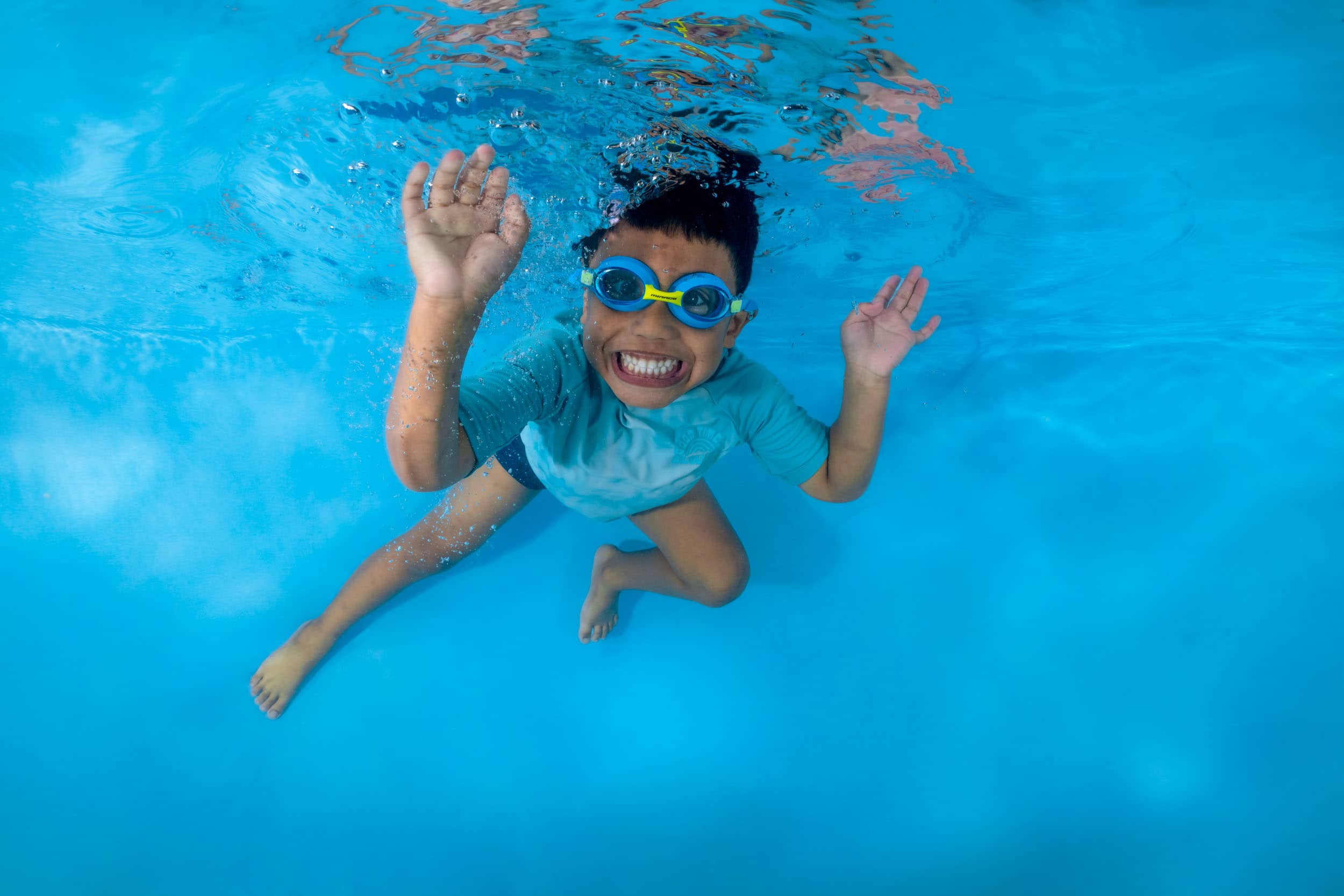 Underwater photo of a child from a swim school photo day.