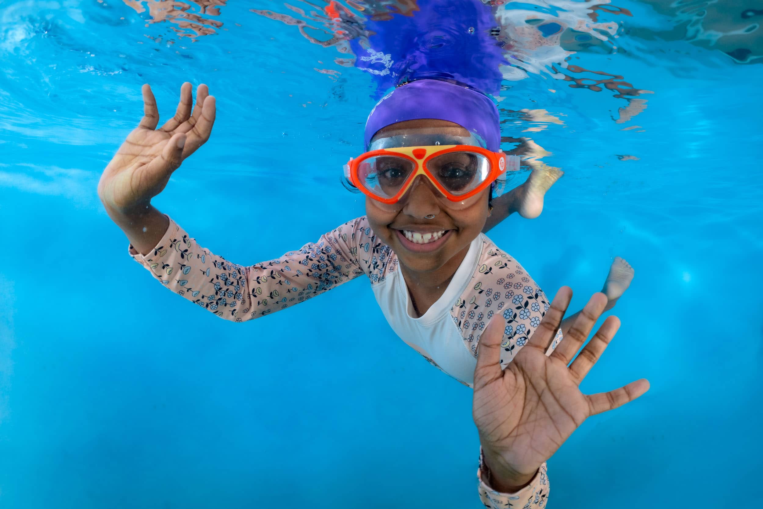 Underwater photo of a child from a swim school photo day.
