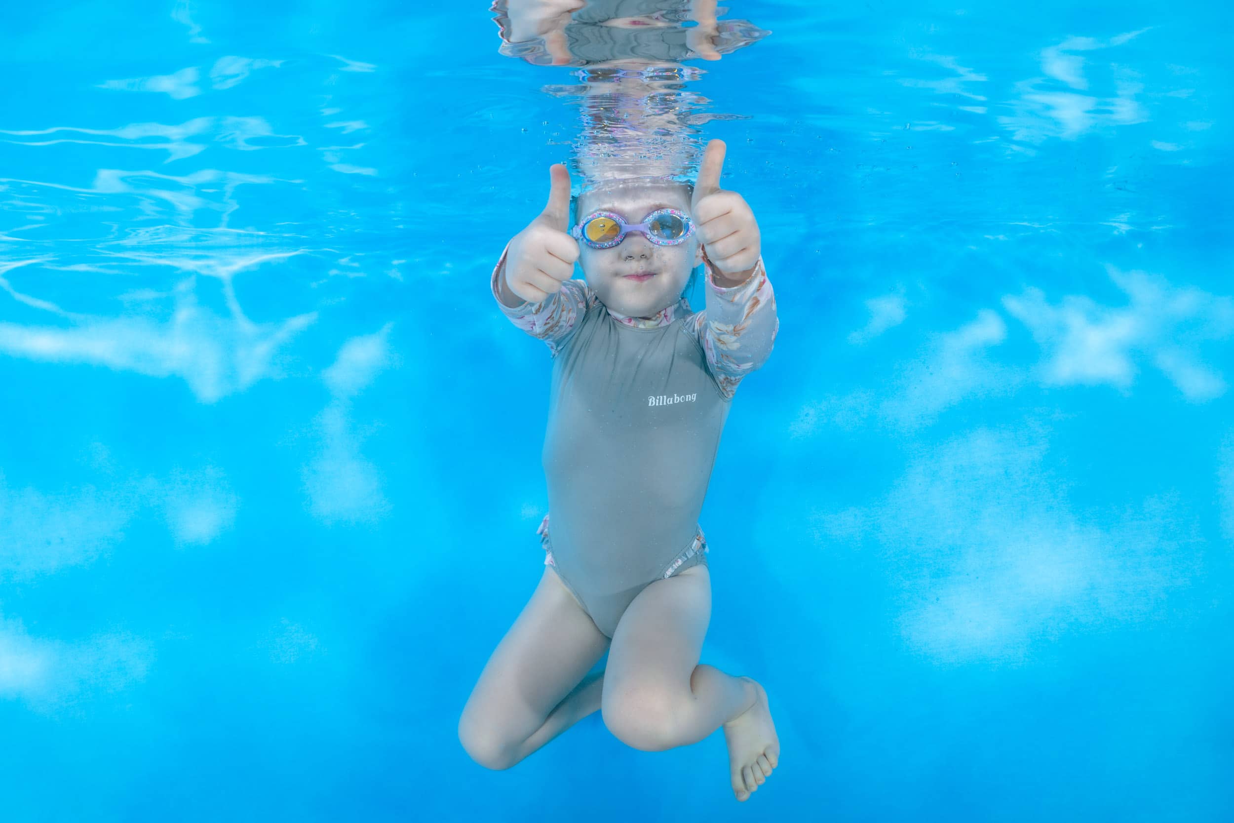 Underwater photo of a child from a swim school photo day.